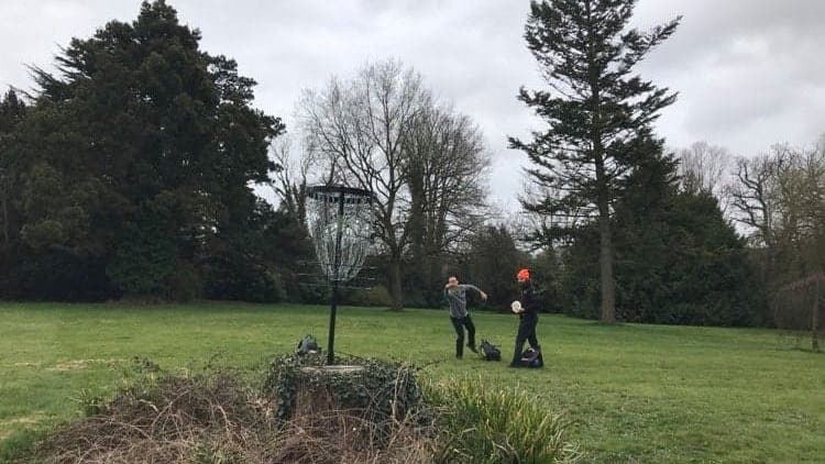 Two players putting towards an elevated basket